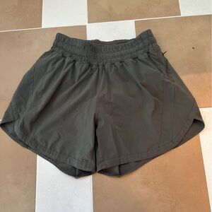 Lululemon high rise track that shorts 4 in- green